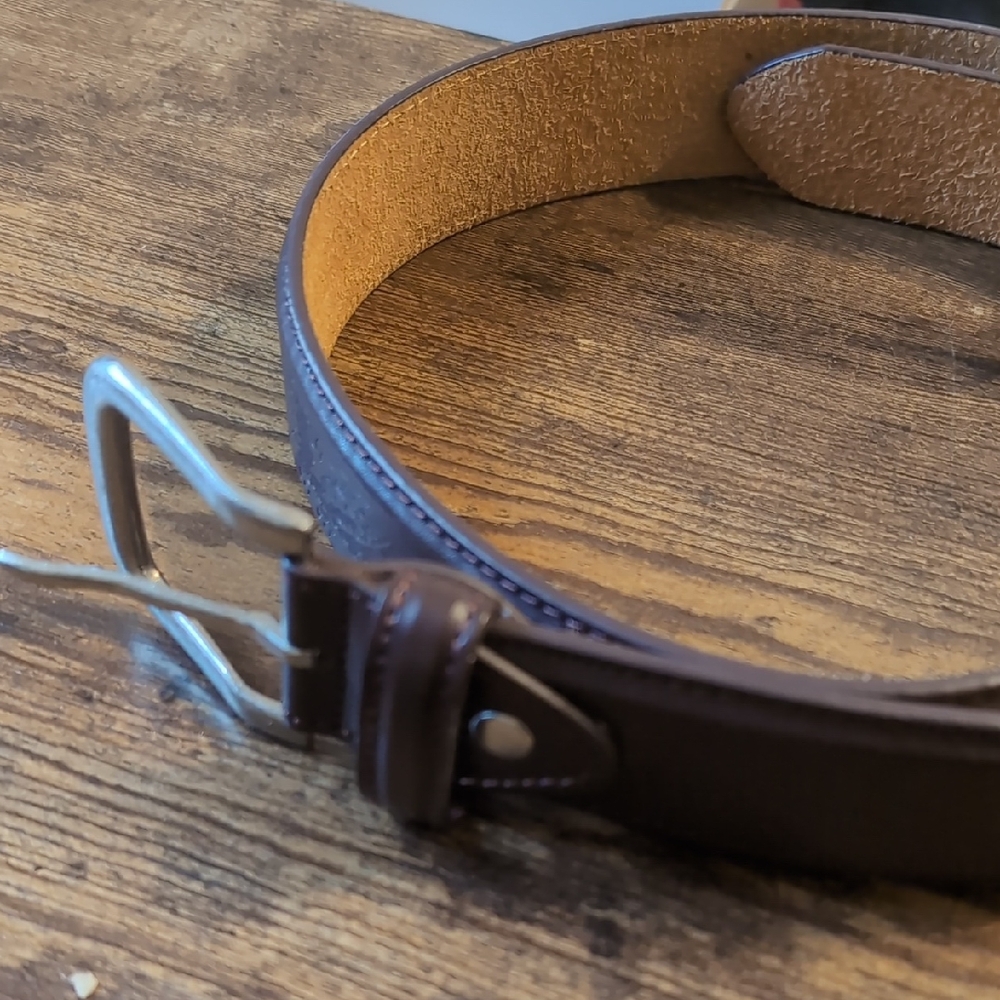 Leather belt with embossed eagle design